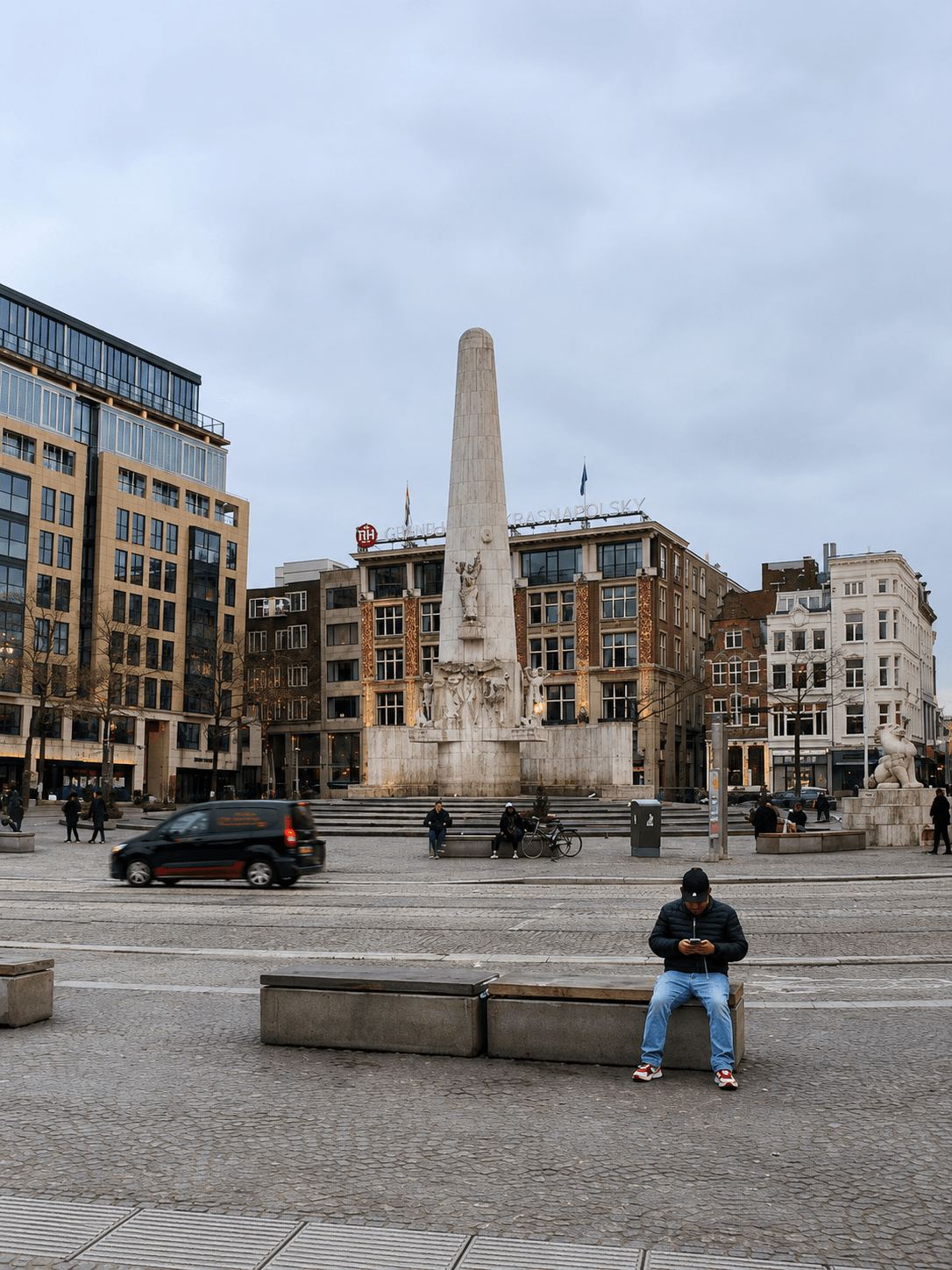 The National Monument on Dam Square The National Monument obelisk on Dam Square in Amsterdam with surrounding buildings