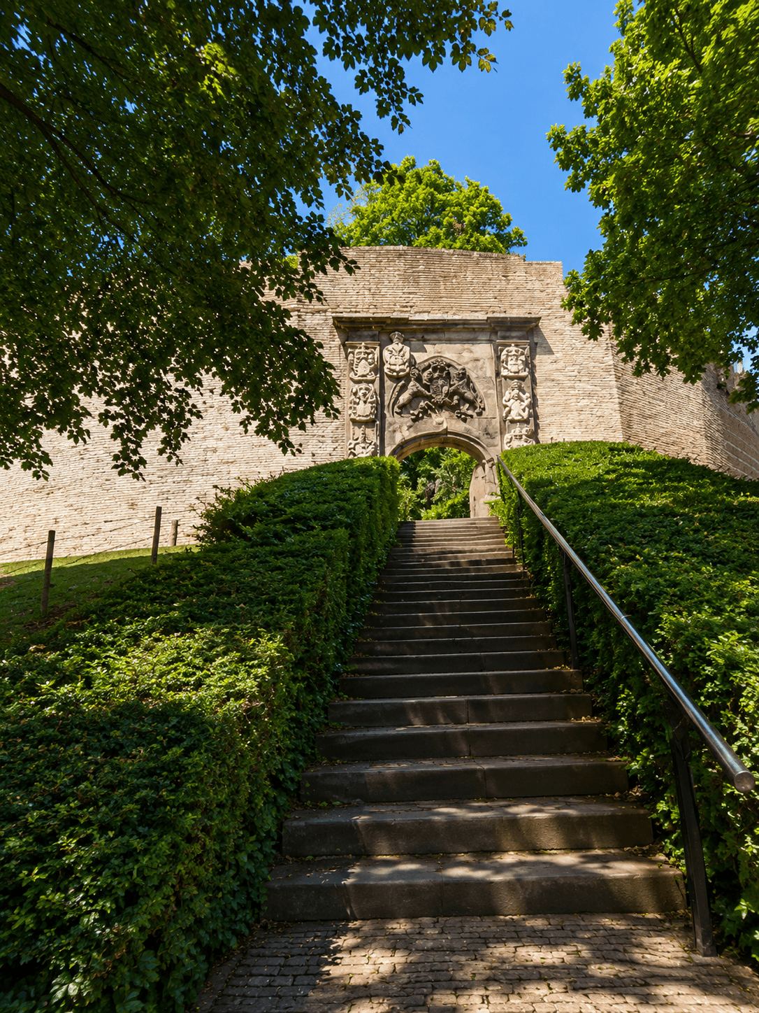 The Steps up to Leiden's Burcht Citadel Stone steps leading up through greenery to the entrance archway of the Burcht van Leiden