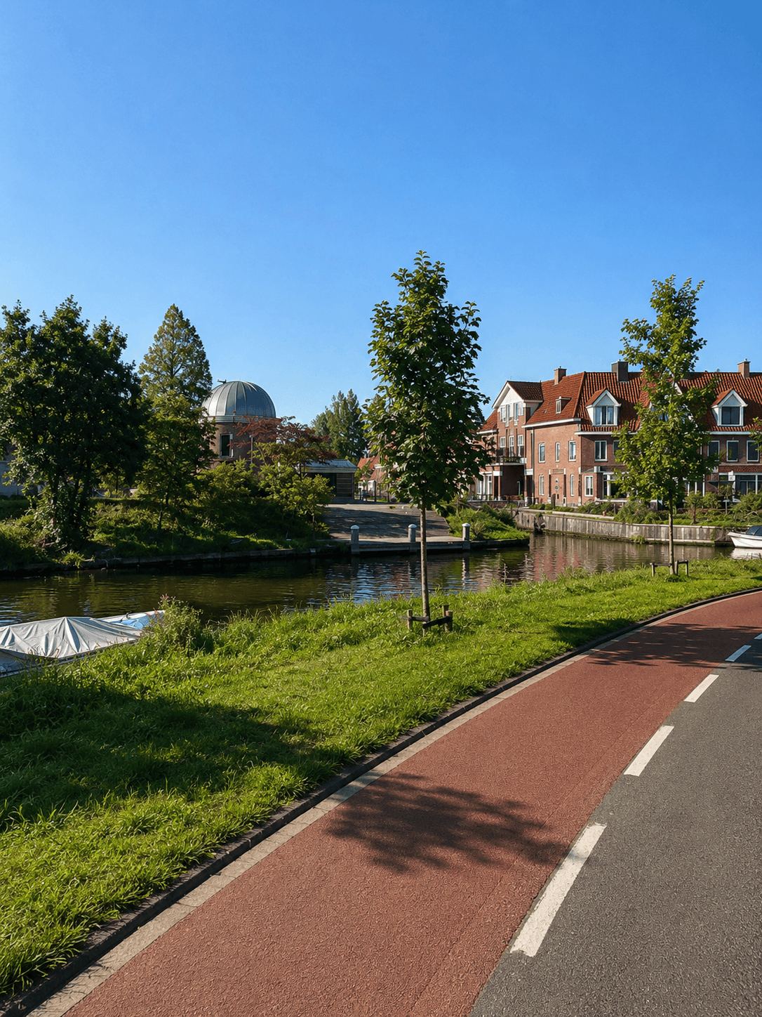 The Cycle Path Past Leiden Observatory Canal-side cycle path in Leiden with the historic observatory dome visible among the trees