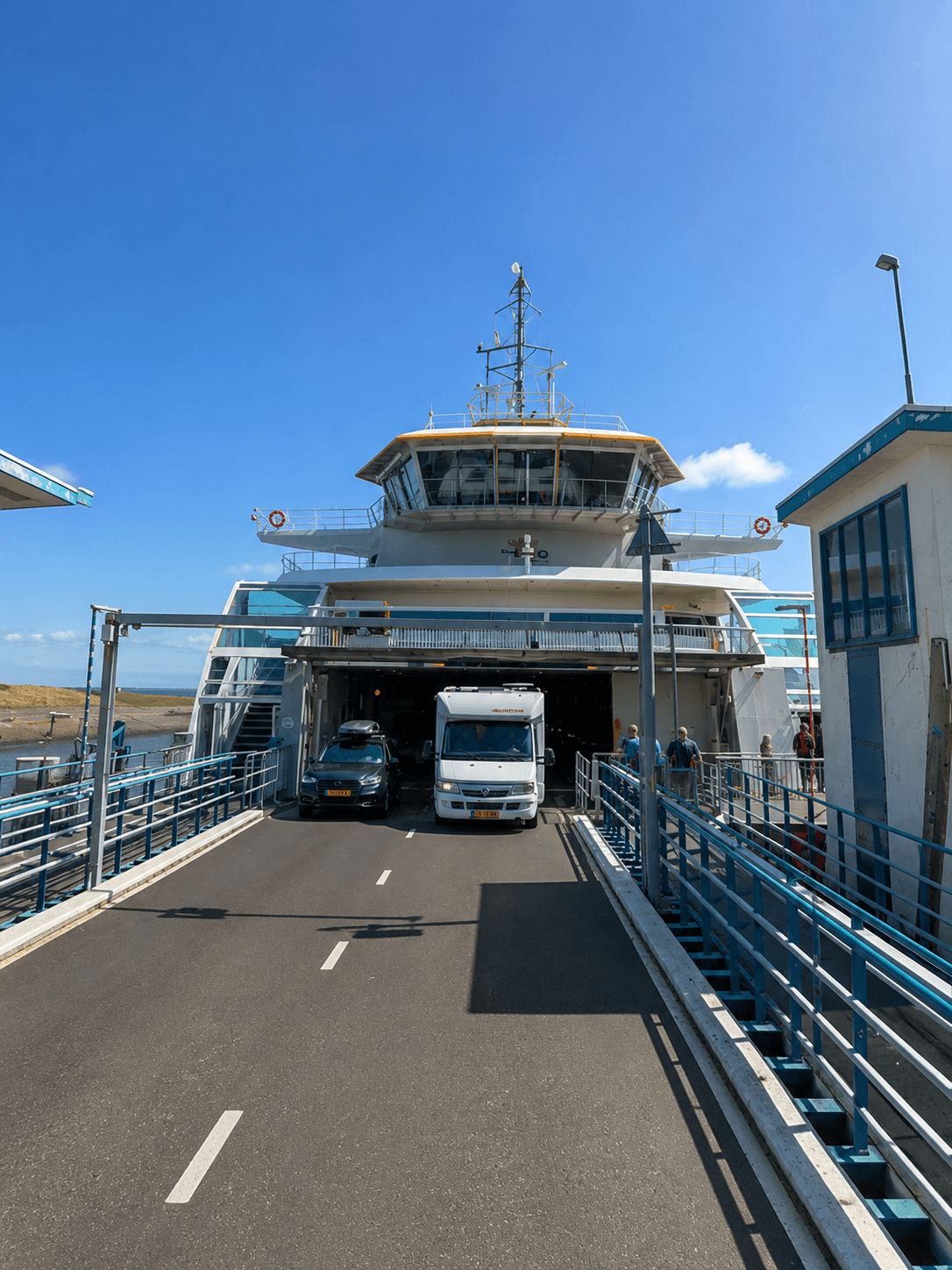 Cars and a campervan boarding the TESO ferry to Texel at the terminal